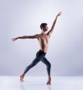 Athletic ballet dancer performing in a studio Royalty Free Stock Photo