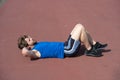 athletic bearded man with muscular body doing exercises for abdominal