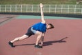 Athletic bearded man with muscular body doing exercises