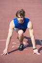 Athletic bearded man with muscular body stretching on running tr Royalty Free Stock Photo