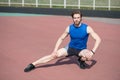 Athletic bearded man with muscular body stretching on running tr Royalty Free Stock Photo