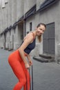 Athletic beautiful woman during fitness class in old european city