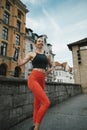 Athletic beautiful woman during fitness class in old european city