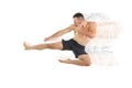 Athletic boxer fighter performing a flying side kick Royalty Free Stock Photo
