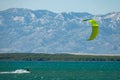 Athletic Caucasian male is kitesurfing in the scenic Adriatic seaside in Croatia