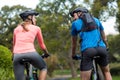 Athletic couple cycling on the road Royalty Free Stock Photo