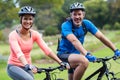 Athletic couple cycling on the road Royalty Free Stock Photo