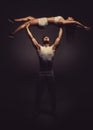 Athletic couple doing acro yoga Royalty Free Stock Photo