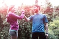 Athletic couple holding hands in forest Royalty Free Stock Photo