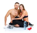 Athletic couple - man and woman after fitness exercise with dumb