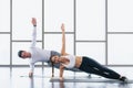 Athletic couple workout  with planking together in gym and fitness center Royalty Free Stock Photo