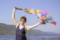 Athletic elderly woman runs along the waves on a summer sunny day Royalty Free Stock Photo