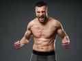 Athletic fighter posing on gray Royalty Free Stock Photo
