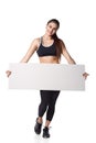 Athletic fitness woman with sign board blank helthy sport isolated white background black clothes Royalty Free Stock Photo