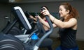 Athletic girl doing an ellipsoid in gym side view Royalty Free Stock Photo