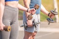 Athletic guy and girl doing exercises with dumbbells at the sports field Royalty Free Stock Photo