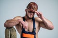 athletic guy with strong muscles in mechanic uniform hold shovel, worker Royalty Free Stock Photo