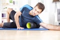 Athletic Guy Using Foam Roller in Exercise Royalty Free Stock Photo
