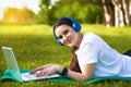 Athletic healthy girl in the headphones working in nature Royalty Free Stock Photo