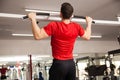 Athletic man doing pullups at a gym Royalty Free Stock Photo