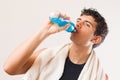 Athletic man drinking energy drink