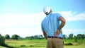 Athletic man golfer suffering sharp lower back pain, sport trauma, health Royalty Free Stock Photo