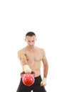 Athletic man holding and lifting up red kettlebell weight Royalty Free Stock Photo