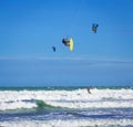 Athletic man jump on kite surf board in sea waves Royalty Free Stock Photo