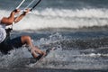 Athletic man jump on kite surf board on a sea waves Royalty Free Stock Photo