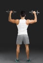 Athletic man lifting weights Royalty Free Stock Photo