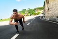 Athletic Man Ready To Start Running Outdoors. Sports Workout Concept