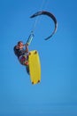 Athletic man riding on kite surf board at sea waves Royalty Free Stock Photo