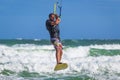 Athletic man riding on kite surf board sea waves Royalty Free Stock Photo