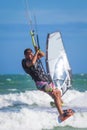 Athletic man riding on kite surf board sea waves Royalty Free Stock Photo