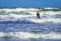 Athletic man riding on kite surf board in sea waves Royalty Free Stock Photo