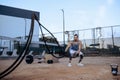 Athletic man with ropes, street workout, crossfit