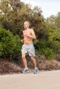 Athletic man runner jogging in nature outdoor Royalty Free Stock Photo