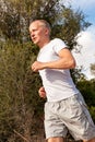 Athletic man runner jogging in nature outdoor Royalty Free Stock Photo