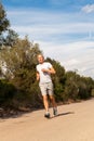 Athletic man runner jogging in nature outdoor Royalty Free Stock Photo