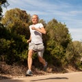 Athletic man runner jogging in nature outdoor Royalty Free Stock Photo