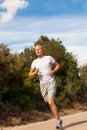 Athletic man runner jogging in nature outdoor Royalty Free Stock Photo