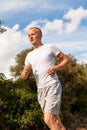 Athletic man runner jogging in nature outdoor Royalty Free Stock Photo