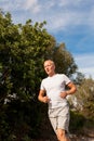 Athletic man runner jogging in nature outdoor Royalty Free Stock Photo