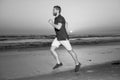 athletic man runner running on sunset summer beach, athlete Royalty Free Stock Photo