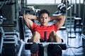 Athletic man sit-up in fitness gym