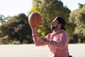 Athletic man in sports wheelchair playing basketball Royalty Free Stock Photo