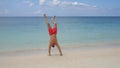 Athletic Man Walking on Hands at the Beach. HD Slow Motion. Koh Phangan, Thailand.