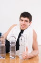 Athletic man with water bottles Royalty Free Stock Photo