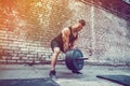 Athletic man working out with a barbell. Strength and motivation. Exercise for the muscles of the back