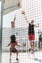 Athletic men playing basketball together on court Royalty Free Stock Photo